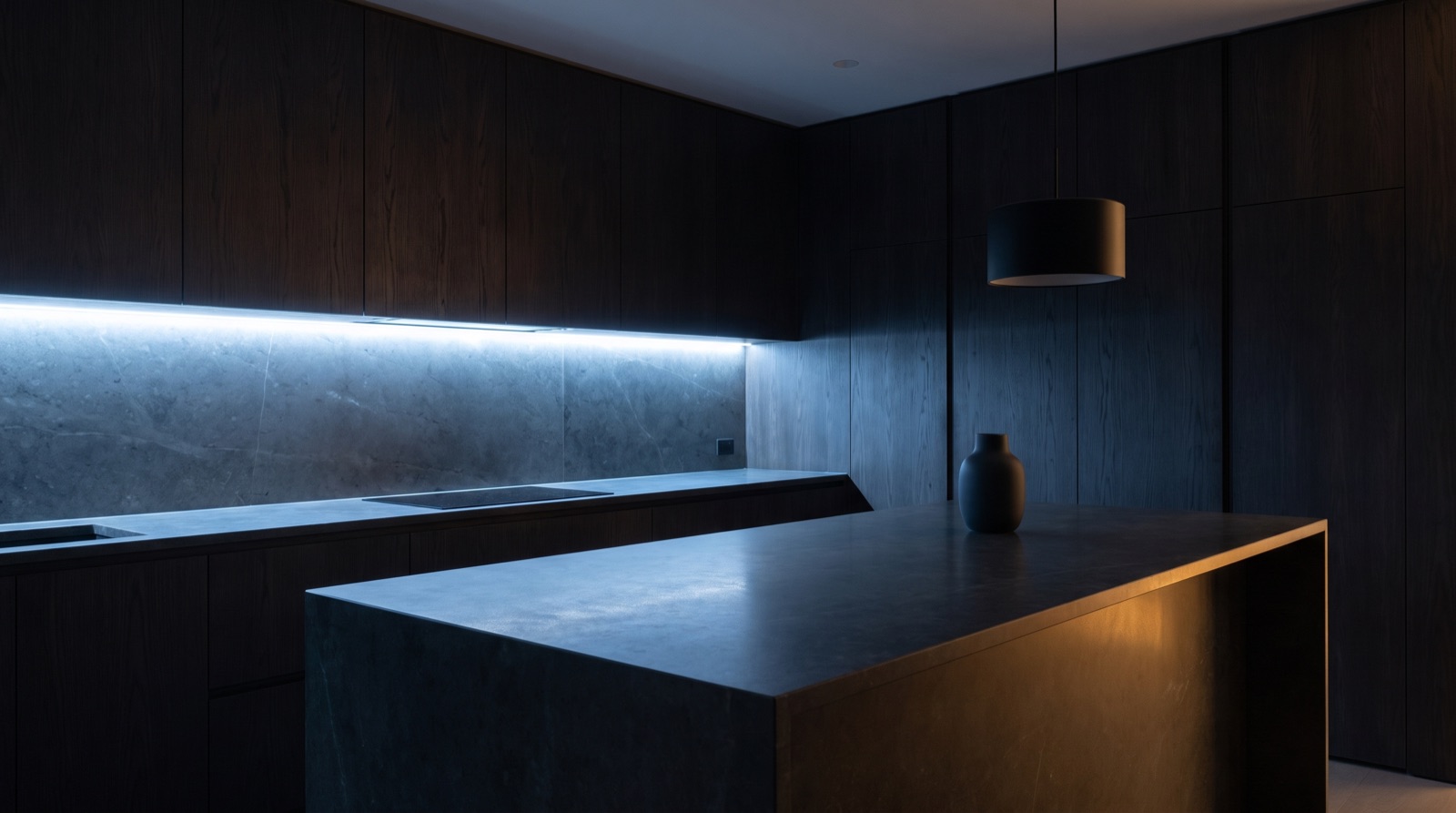 A spotless modern kitchen late at night, counters clear and nothing left out